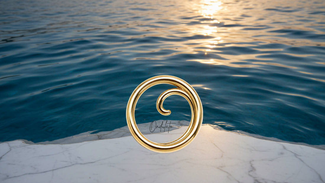 Marble surface meeting Mediterranean blue water with golden Ondulato logo
